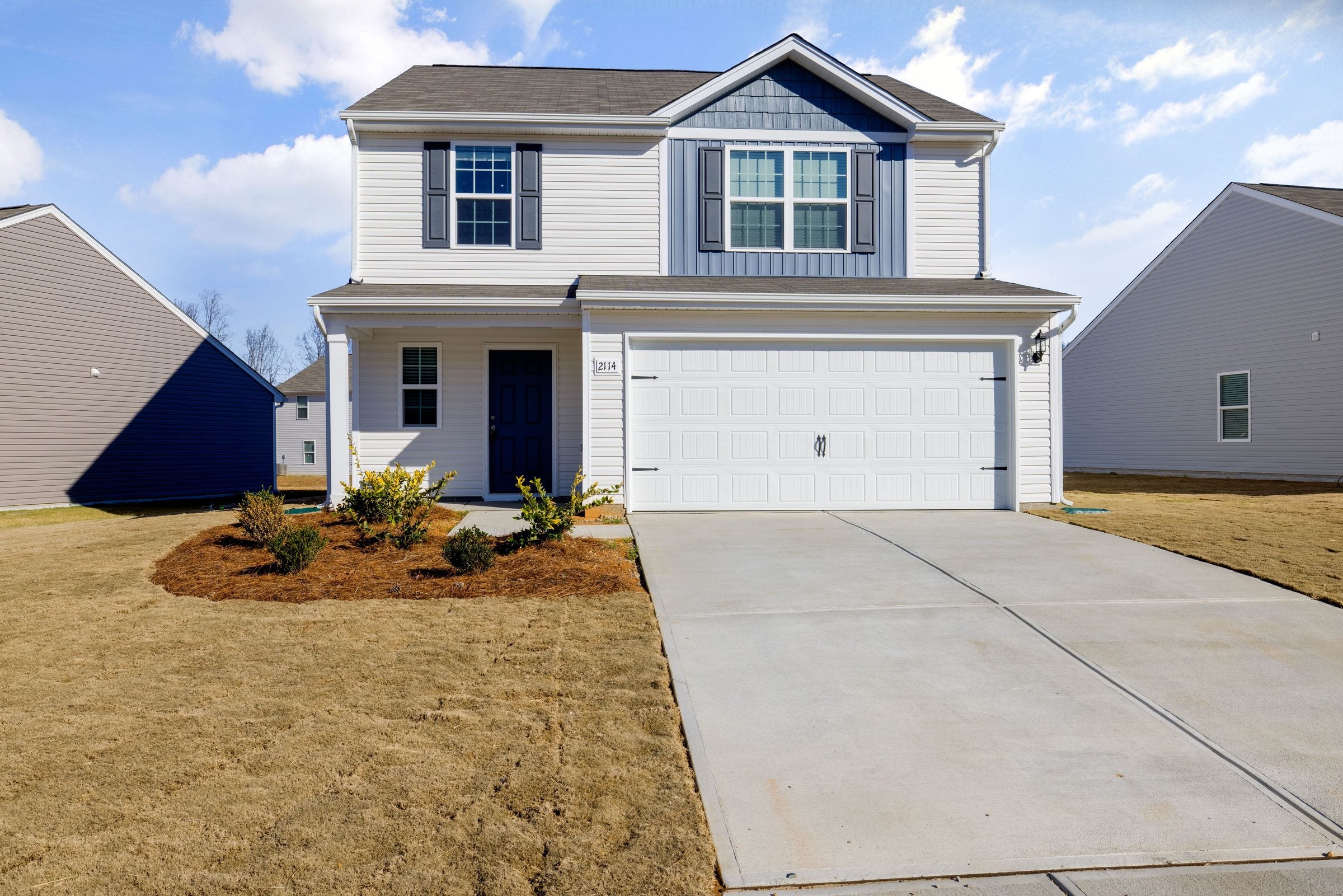 Modern house with a wide, clean concrete driveway